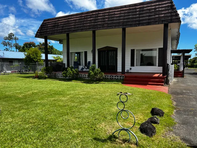 a view of house with outdoor seating