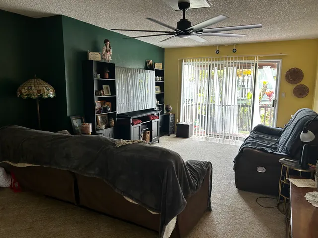 a living room with couches and painted walls