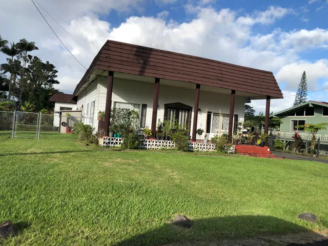 a view of a house that has a garden