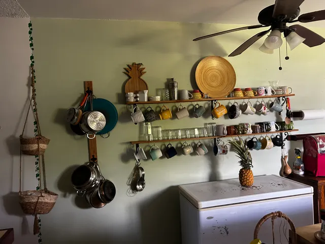 a bathroom with a washing machine and a mirror