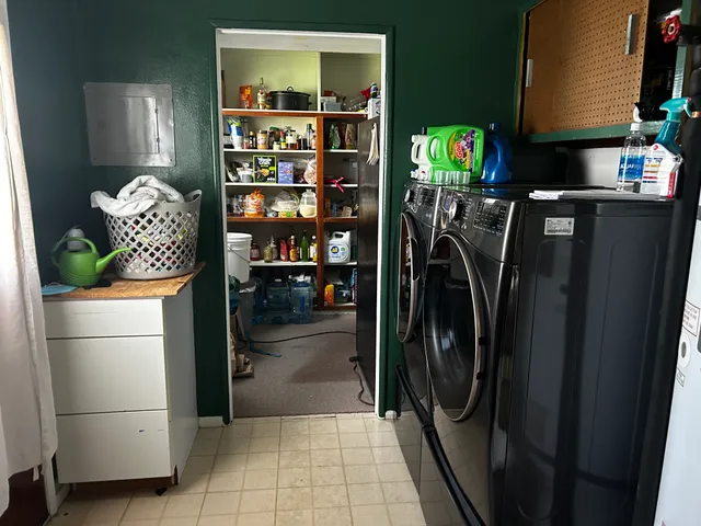 a bathroom with a sink vanity granite tub shower and mirror