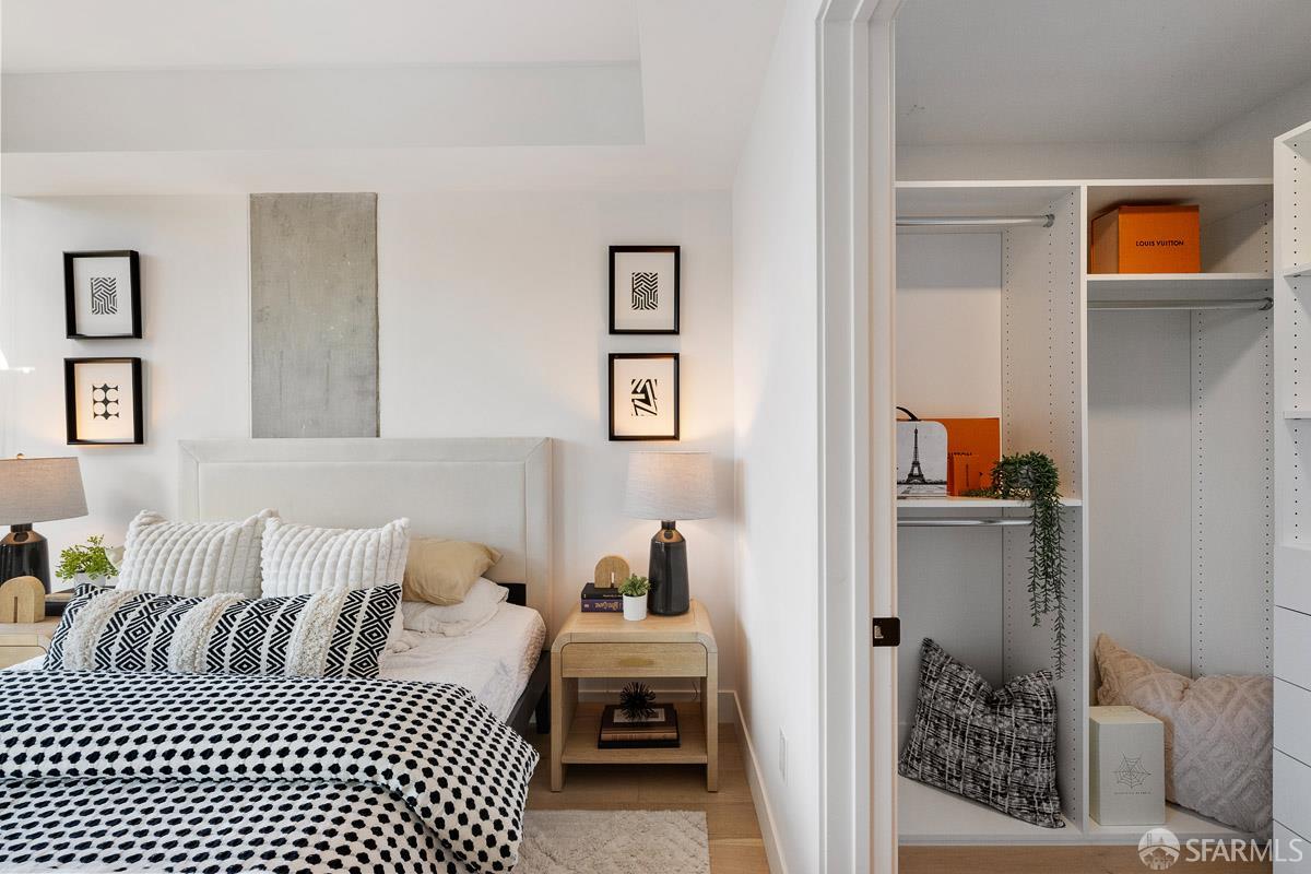 2177 3rd Street, Unit 609 San Francisco, CA 94107 - Photo 14 of 32 a bedroom with a bed and a couch