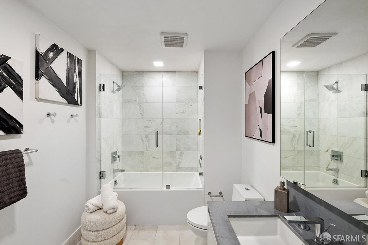 2177 3rd Street, Unit 609 San Francisco, CA 94107 - Photo 15 of 32 a bathroom with a bathtub shower sink and toilet