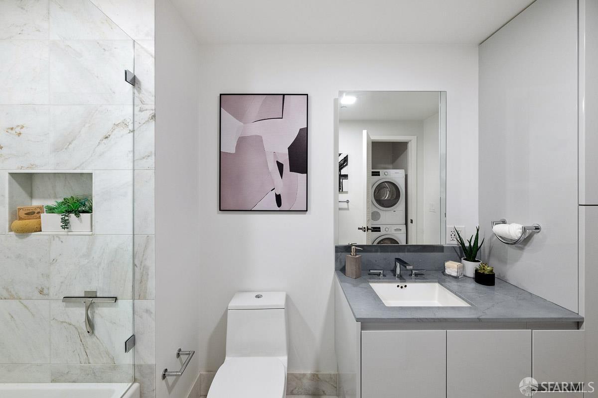 2177 3rd Street, Unit 609 San Francisco, CA 94107 - Photo 16 of 32 a bathroom with a toilet sink and mirror