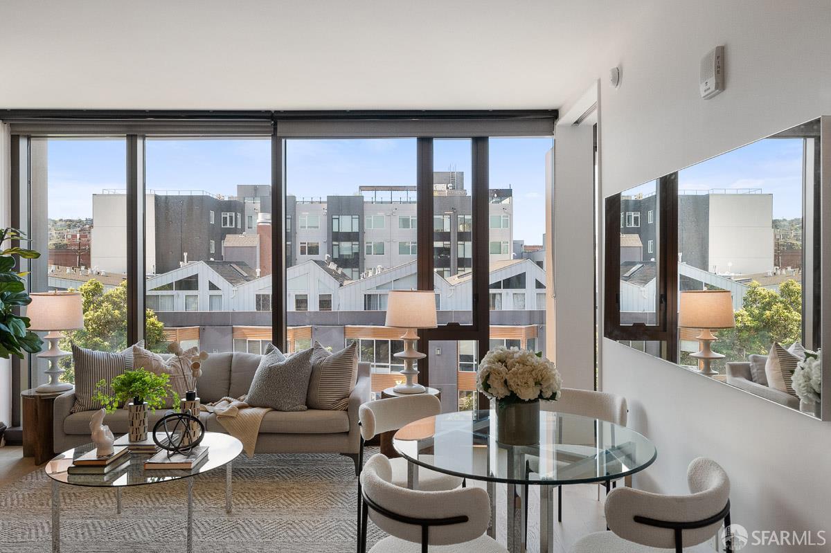 2177 3rd Street, Unit 609 San Francisco, CA 94107 - Photo 2 of 32 a living room with furniture and a large window
