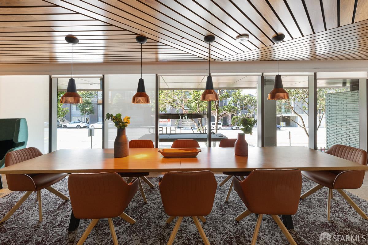 2177 3rd Street, Unit 609 San Francisco, CA 94107 - Photo 22 of 32 a view of a dining room with furniture wooden floor and a potted plant