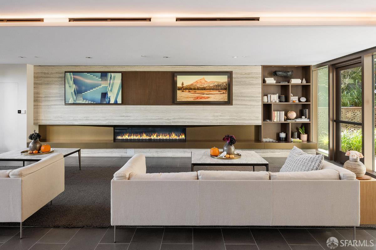 2177 3rd Street, Unit 609 San Francisco, CA 94107 - Photo 27 of 32 a living room with furniture and a fireplace