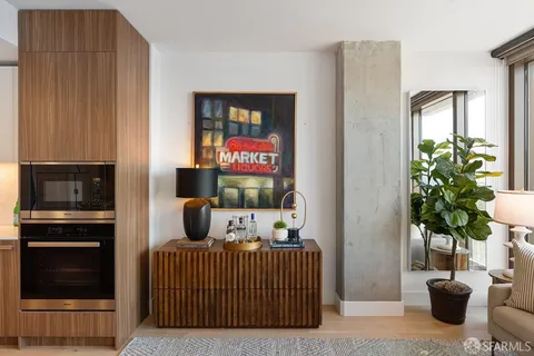 a bedroom with furniture and a potted plant