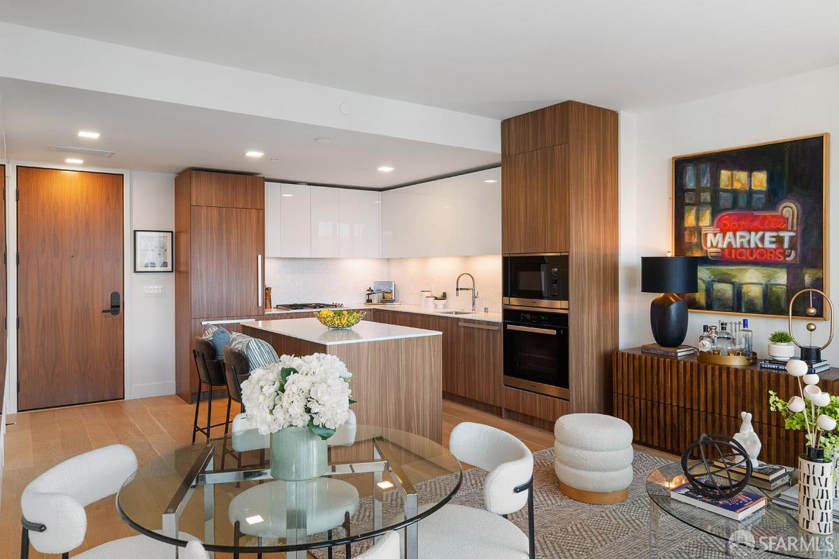2177 3rd Street, Unit 609 San Francisco, CA 94107 - Photo 5 of 32 a kitchen with a table chairs stove and refrigerator