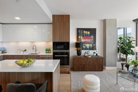 a living room with furniture a rug and a fireplace