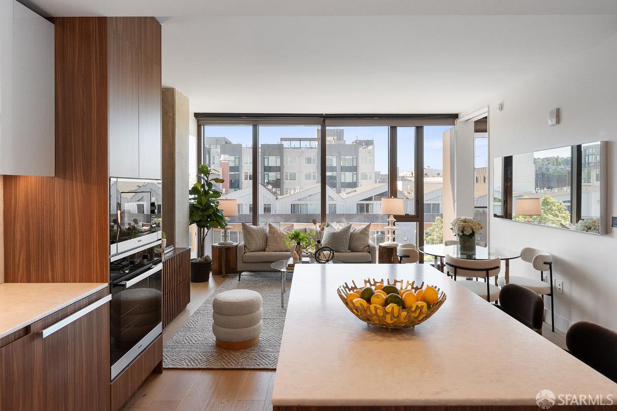 2177 3rd Street, Unit 609 San Francisco, CA 94107 - Photo 9 of 32 a living room with furniture and a large window