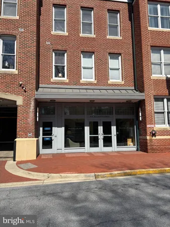 a view of a brick building with many windows