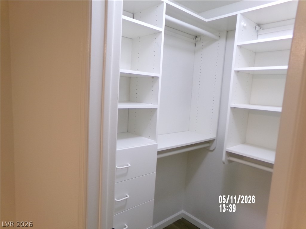 2995 East Sunset Road, Unit 222 Las Vegas, NV 89120 - Photo 19 of 29 This organized walk-in closet offers extensive storage solutions with shelving and hanging space.