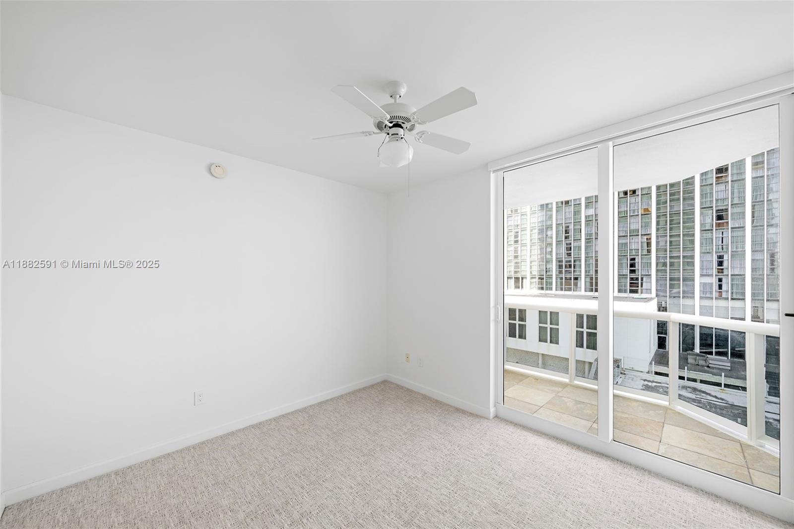 4779 Collins Avenue, Unit 501 Miami Beach, FL 33140 - Photo 15 of 45 an empty room with windows