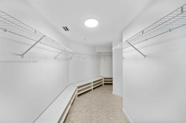 a view of a room with racks on the wall