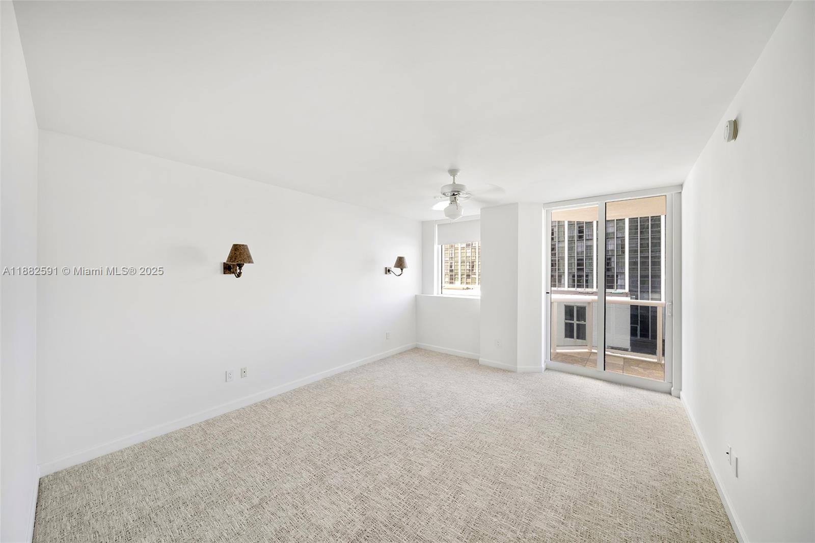 4779 Collins Avenue, Unit 501 Miami Beach, FL 33140 - Photo 20 of 45 an empty room with windows