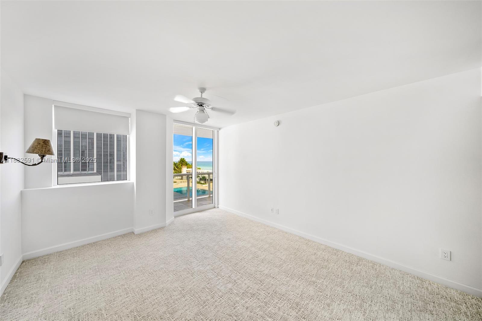 4779 Collins Avenue, Unit 501 Miami Beach, FL 33140 - Photo 21 of 45 an empty room with windows and closet