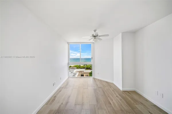 a view of an empty room with a window