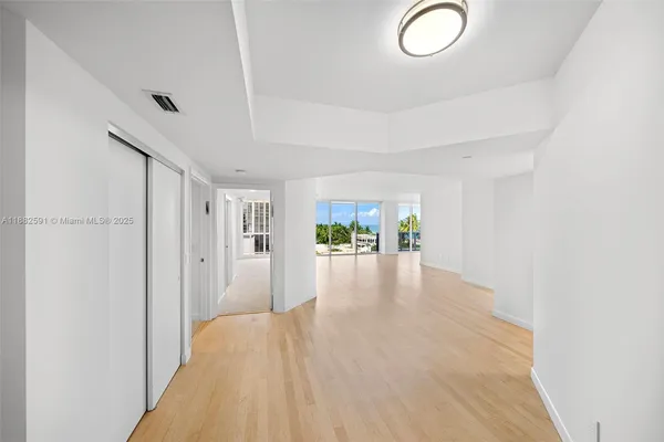 a view of a livingroom with wooden floor
