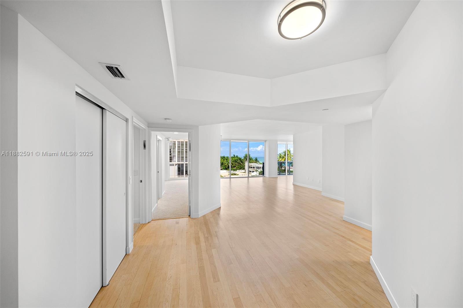 4779 Collins Avenue, Unit 501 Miami Beach, FL 33140 - Photo 6 of 45 a view of a livingroom with wooden floor