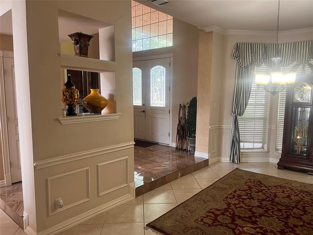 341 Rolling Oaks Ridge Cedar Hill, TX 75104 - Photo 16 of 27 Foyer with light tile patterned floors and baseboards