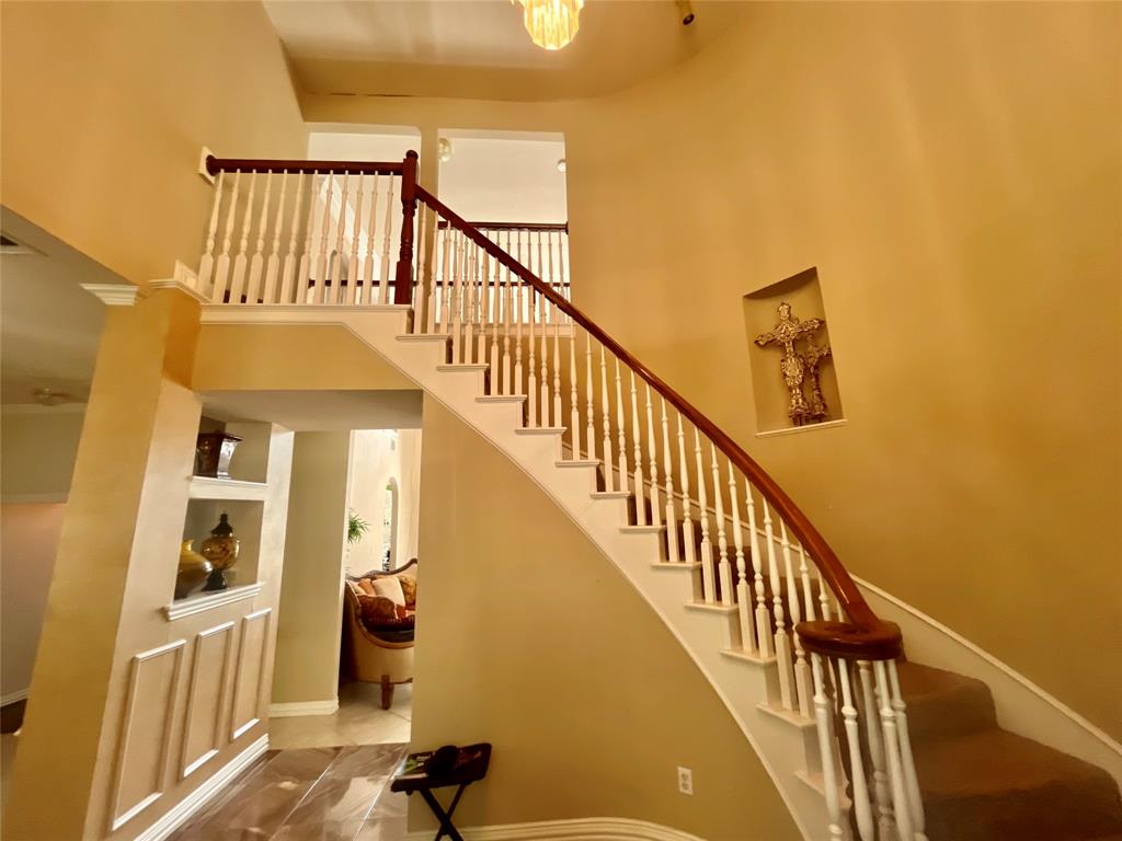 341 Rolling Oaks Ridge Cedar Hill, TX 75104 - Photo 5 of 27 Stairway with a towering ceiling