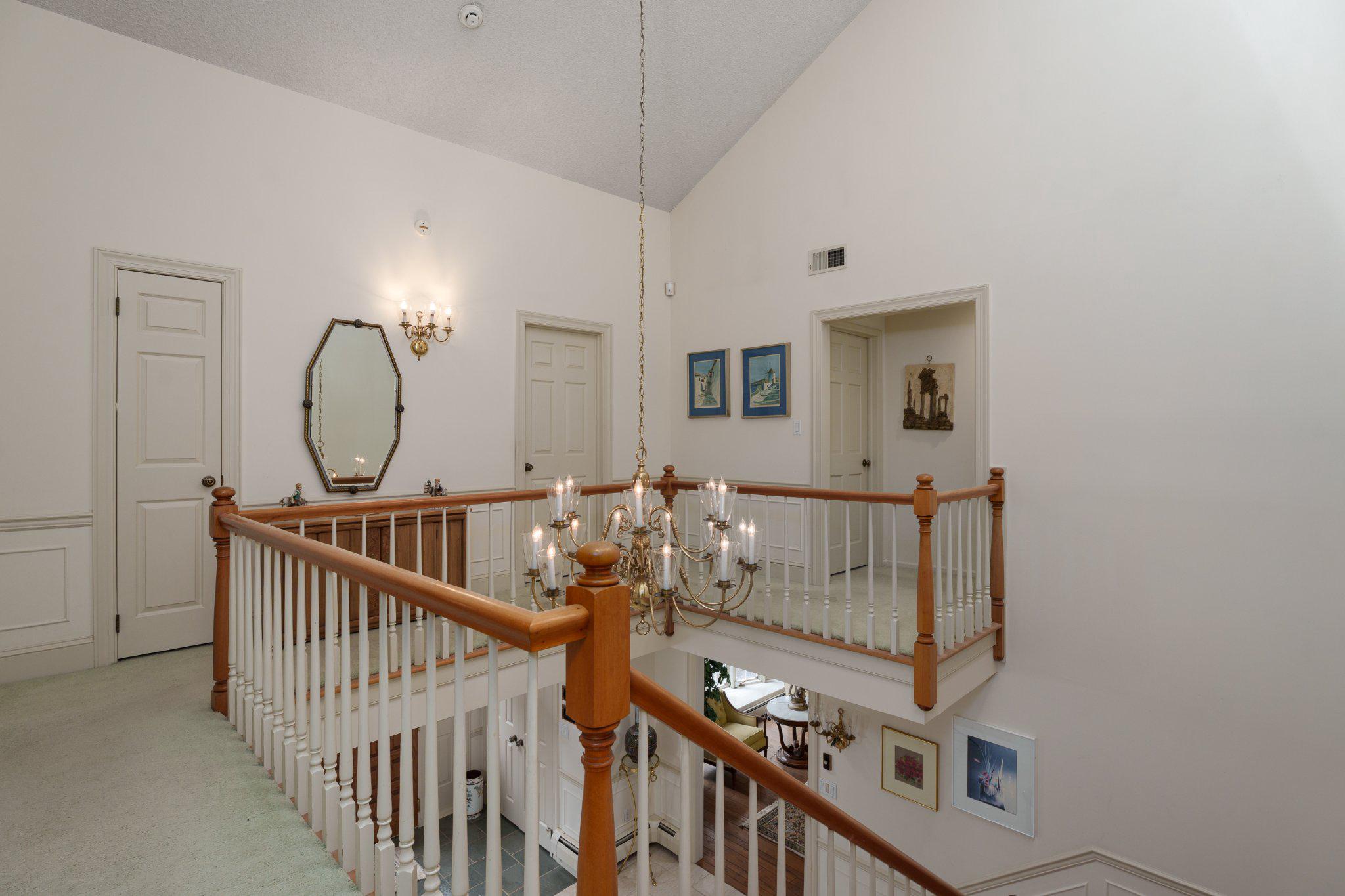 338 Gallup Road Princeton, NJ 08540 - Photo 31 of 53 a view of a hallway with paintings on the wall