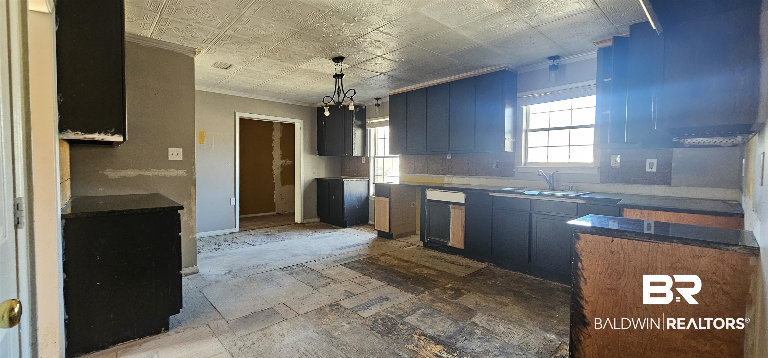 151 Bullard Street Atmore, AL 36502 - Photo 18 of 38 Kitchen featuring an ornate ceiling, crown molding, pendant lighting, and a chandelier