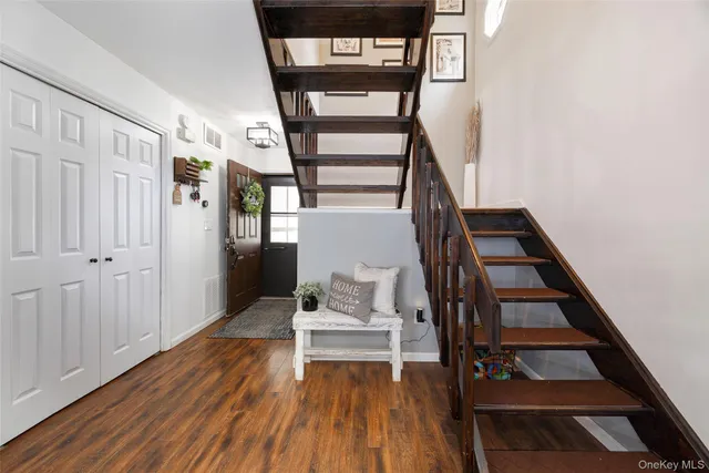 a view of entryway with wooden floor