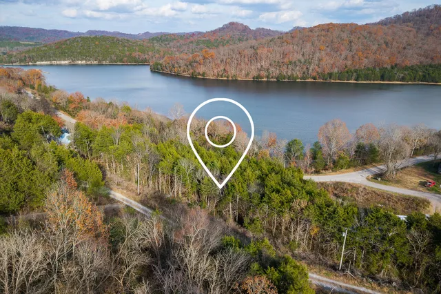 a aerial view of a house with a lake view