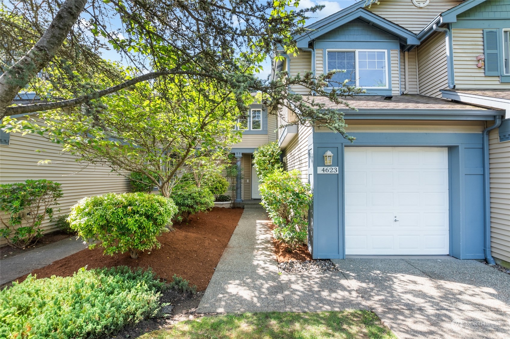 4623 Northeast 6th Court Renton, WA 98059 - Photo 1 of 40 a front view of a house with garden