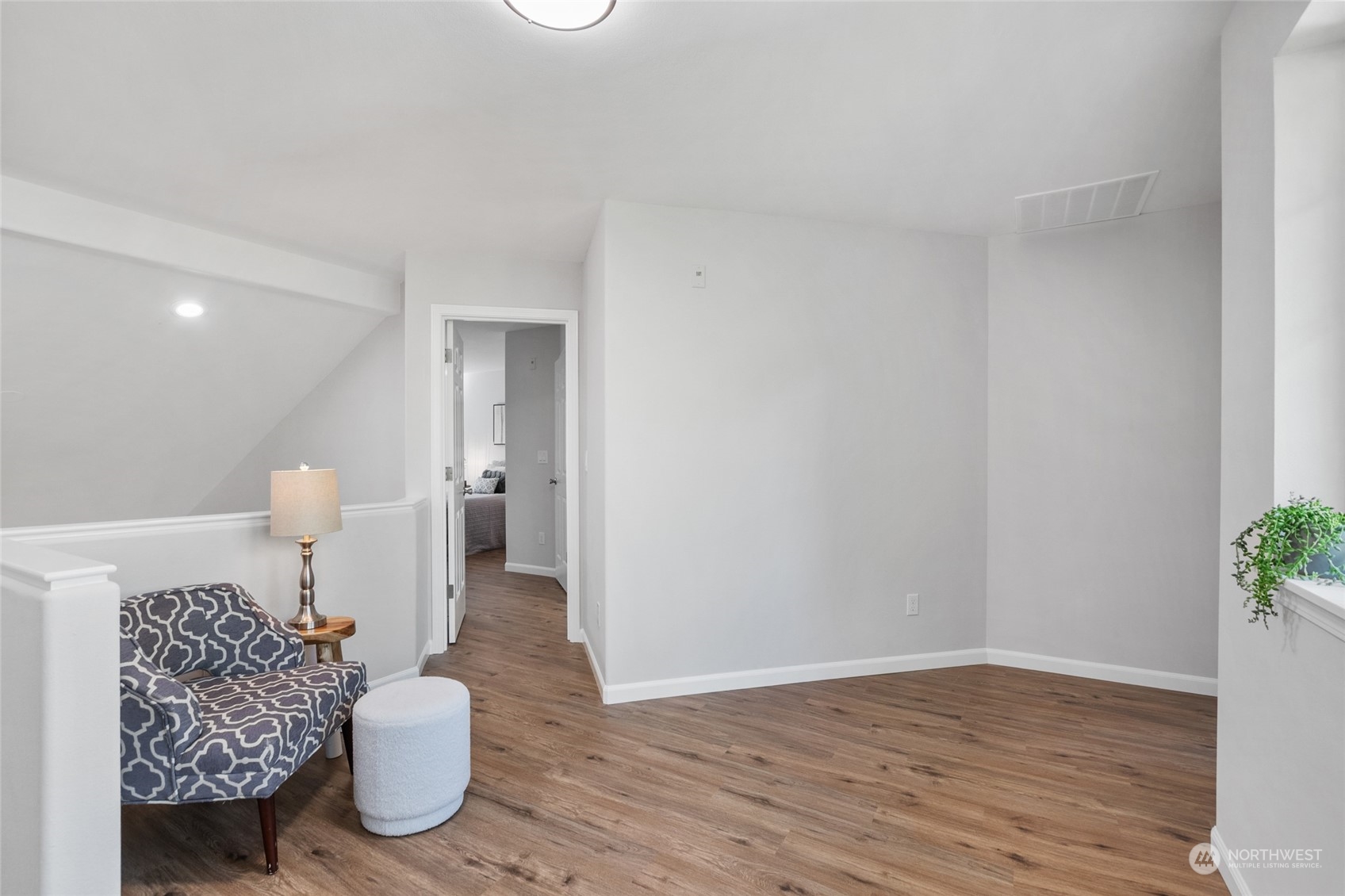 4623 Northeast 6th Court Renton, WA 98059 - Photo 23 of 40 a view of an empty room and wooden floor