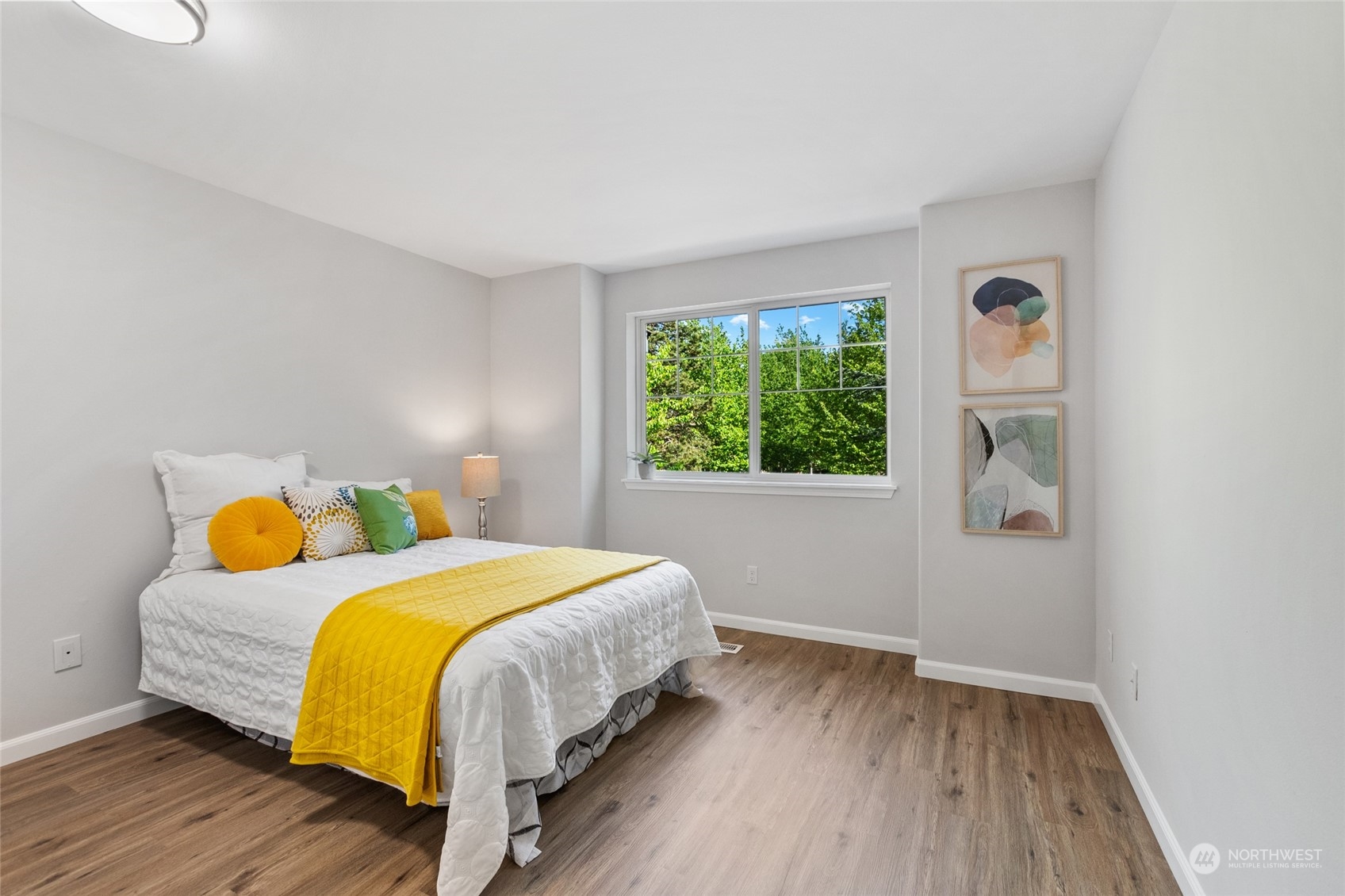 4623 Northeast 6th Court Renton, WA 98059 - Photo 27 of 40 a bedroom with a bed and a window