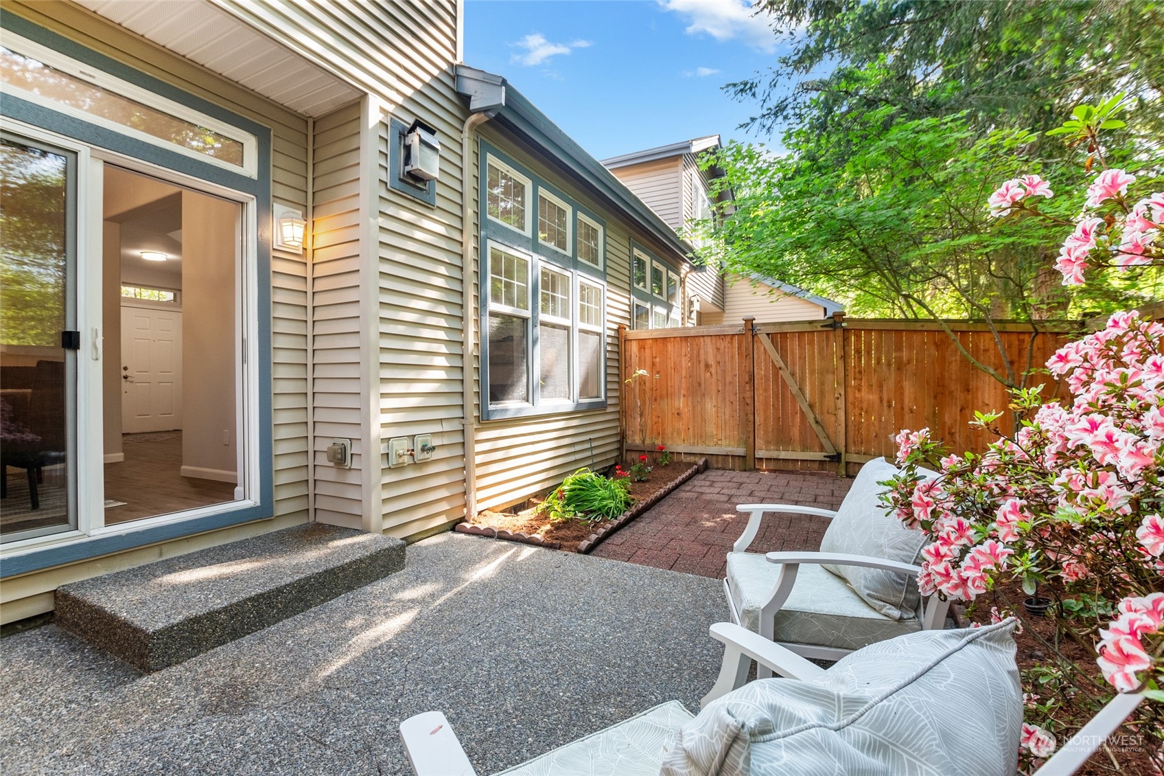 4623 Northeast 6th Court Renton, WA 98059 - Photo 33 of 40 a view of backyard with a chair and potted plants