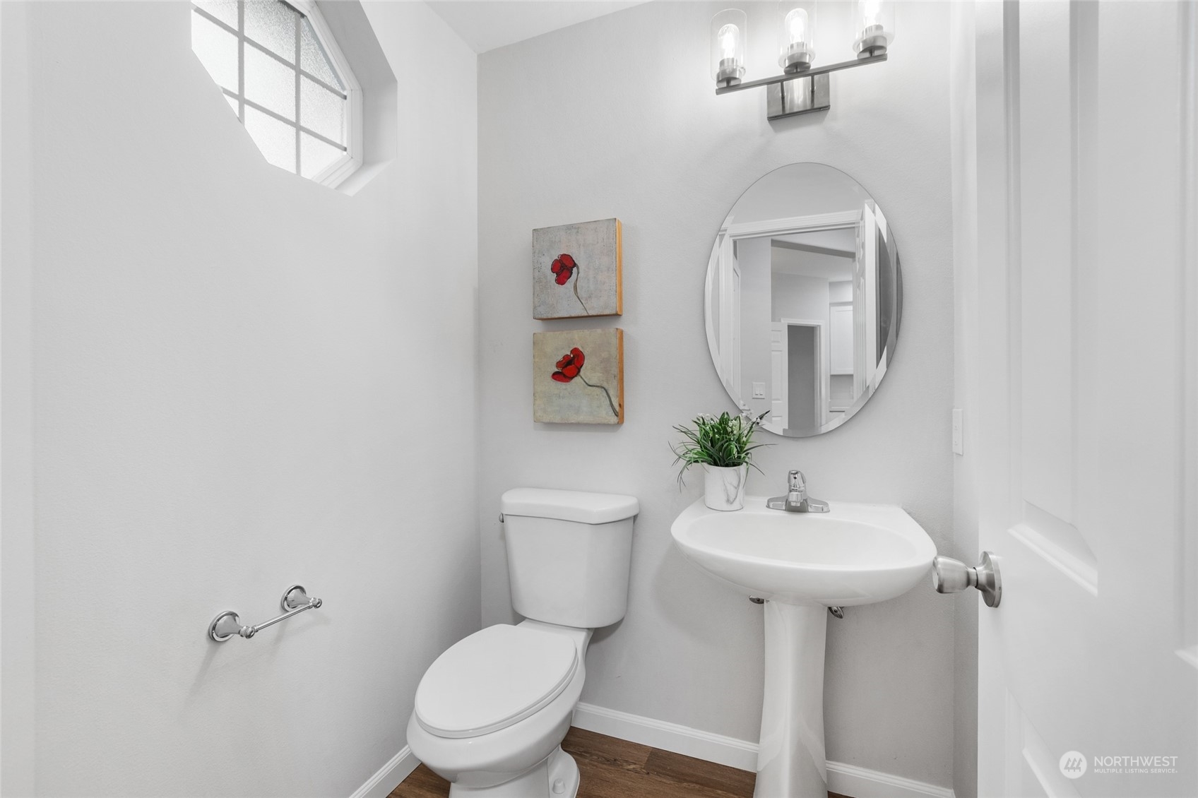 4623 Northeast 6th Court Renton, WA 98059 - Photo 4 of 40 a bathroom with a sink toilet and a mirror