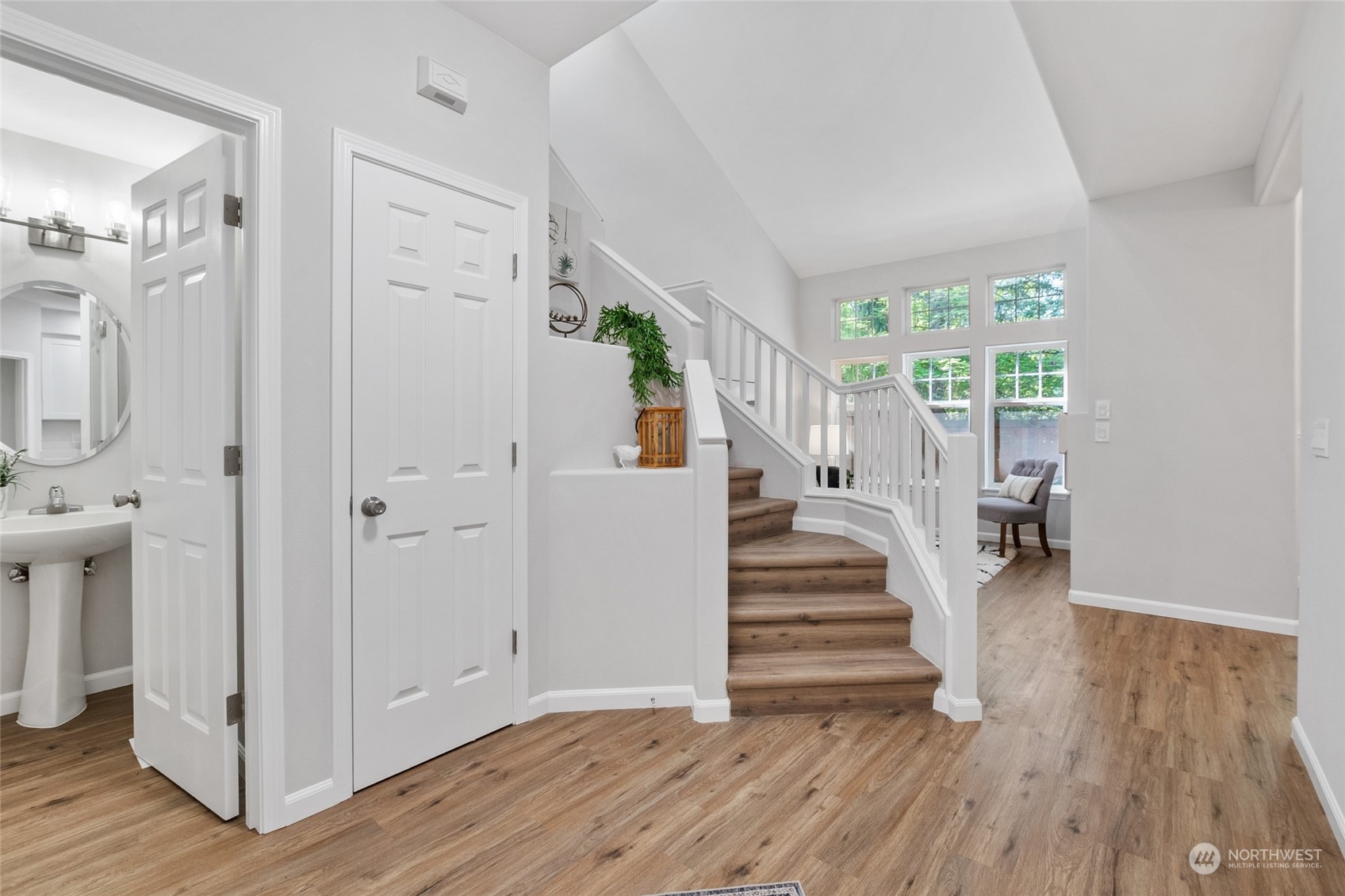 4623 Northeast 6th Court Renton, WA 98059 - Photo 5 of 40 a view of an entryway with wooden floor and staircase