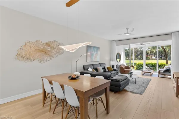 a living room with furniture and a lamp