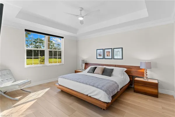 a bedroom with a bed and a mirror