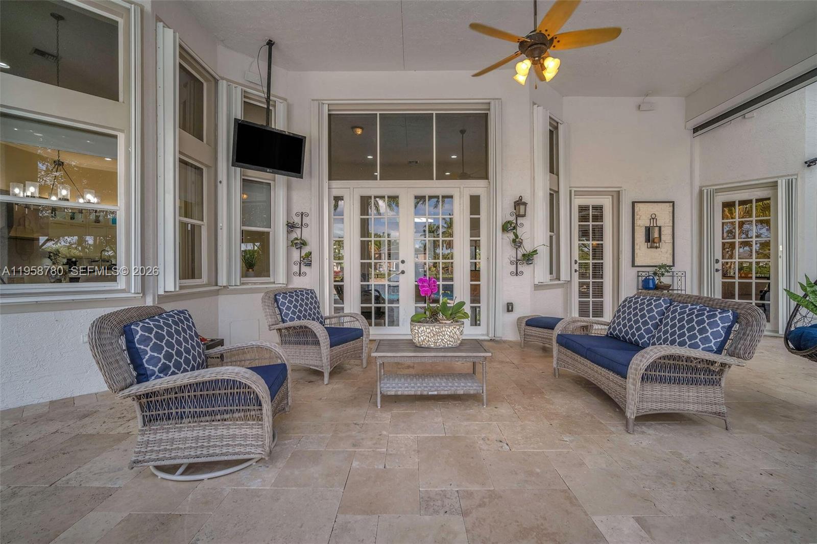 14931 Southwest 38th Street Davie, FL 33331 - Photo 25 of 82 a living room with furniture and a flat screen tv