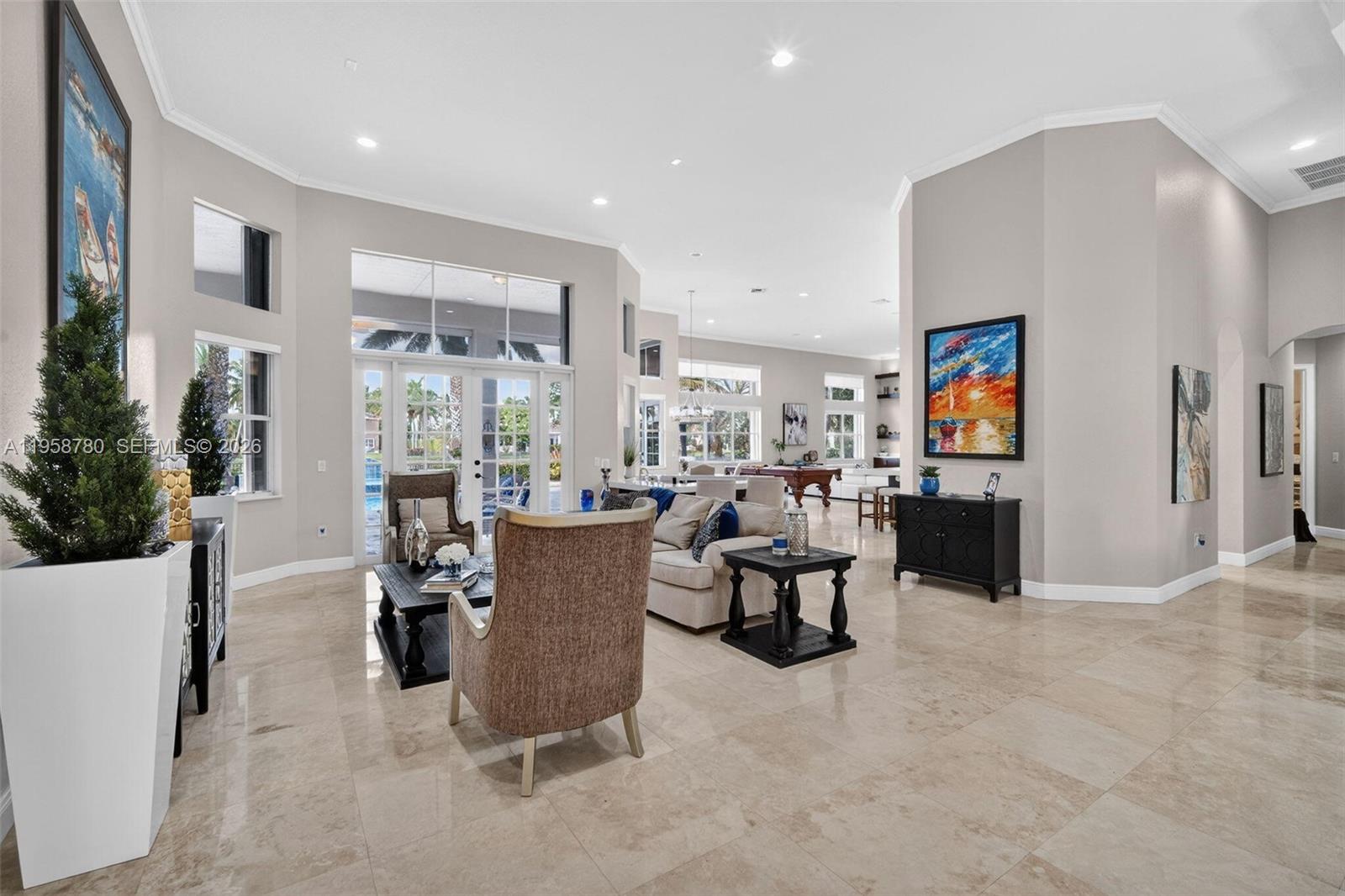 14931 Southwest 38th Street Davie, FL 33331 - Photo 33 of 82 a living room with furniture and a large window