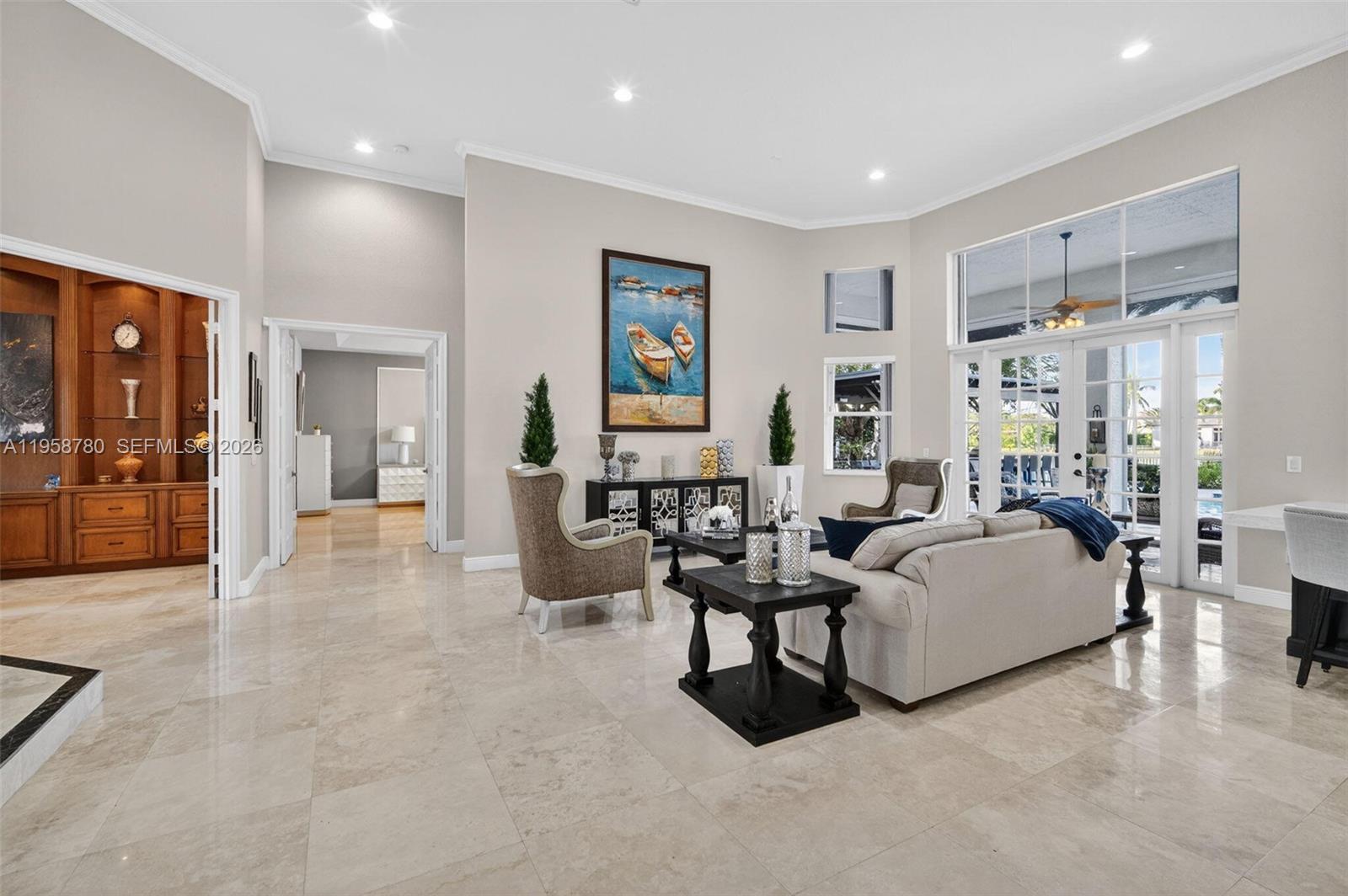 14931 Southwest 38th Street Davie, FL 33331 - Photo 37 of 82 a living room with furniture and large window