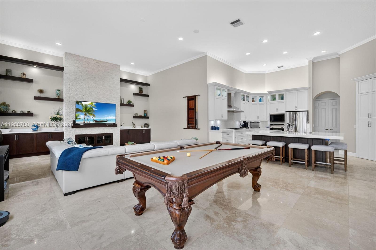 14931 Southwest 38th Street Davie, FL 33331 - Photo 46 of 82 a living room with furniture and a table