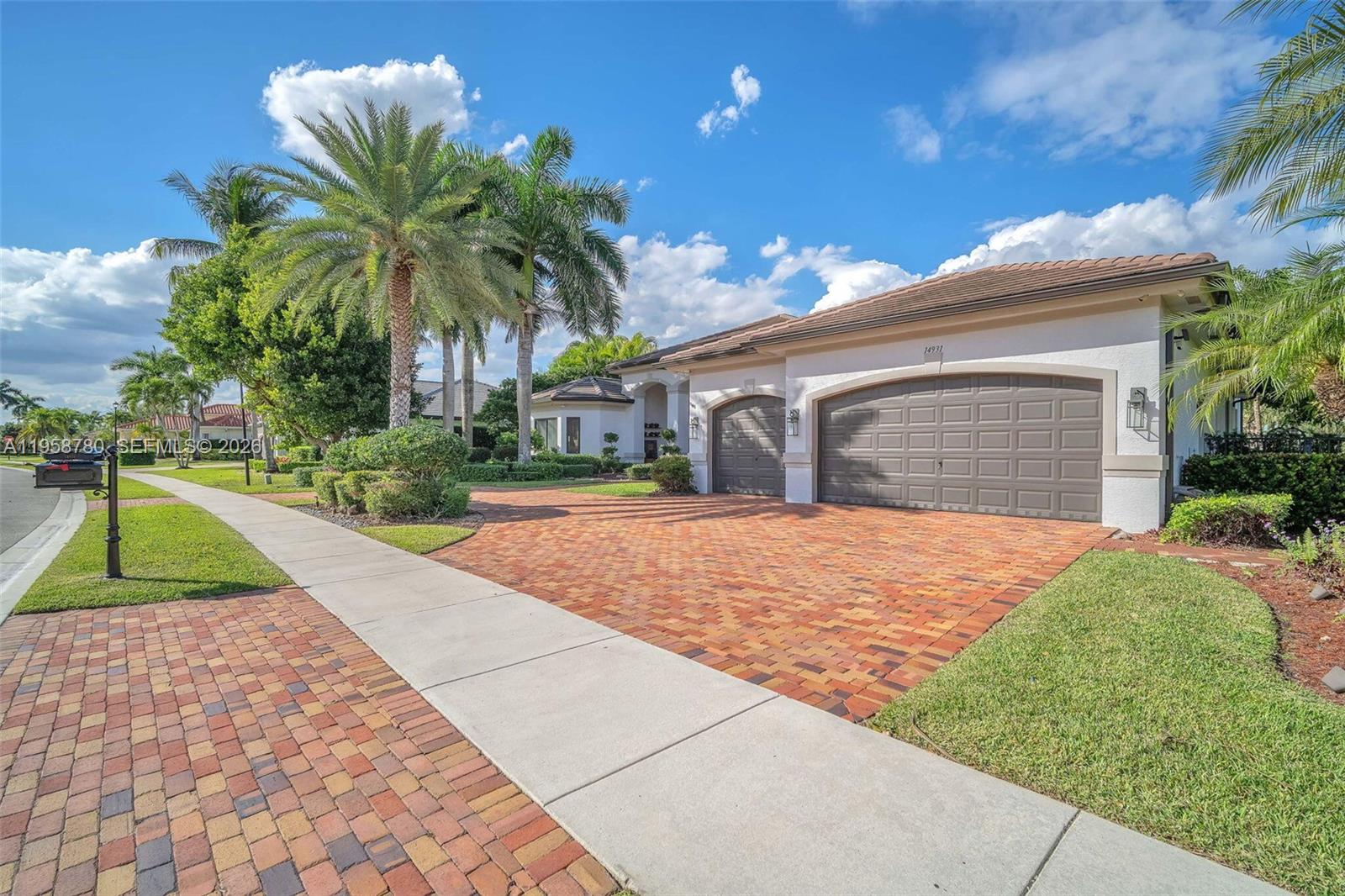 14931 Southwest 38th Street Davie, FL 33331 - Photo 7 of 82 a house with palm tree in front of it