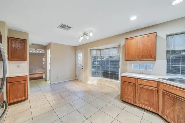 a large kitchen with cabinets and counter space