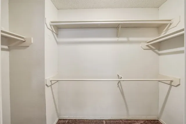 a bathroom with a tub a sink and a large mirror