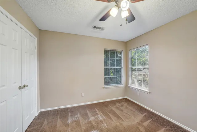 a bathroom with a sink toilet and window
