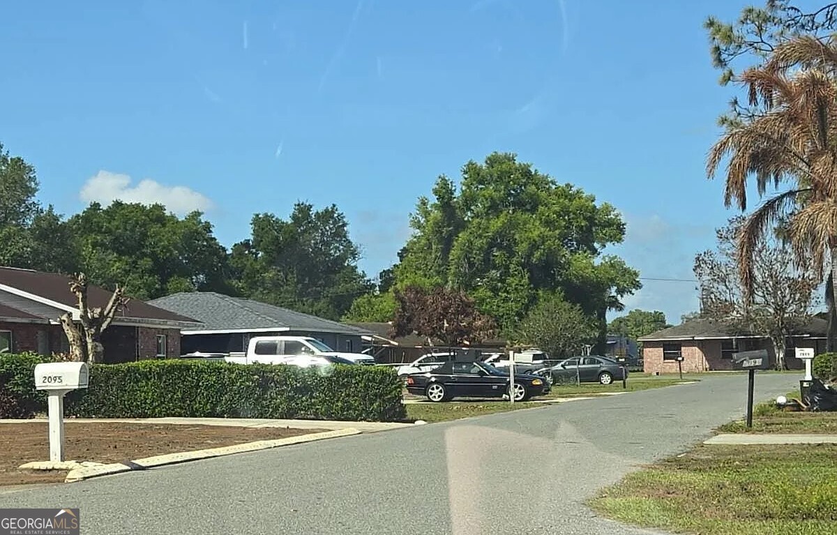 2190 Green Tree Court Bartow, FL 33830 - Photo 5 of 5 a front view of a house with a yard and trees