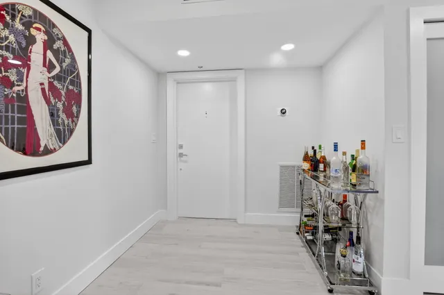 a view of a hallway with shelves