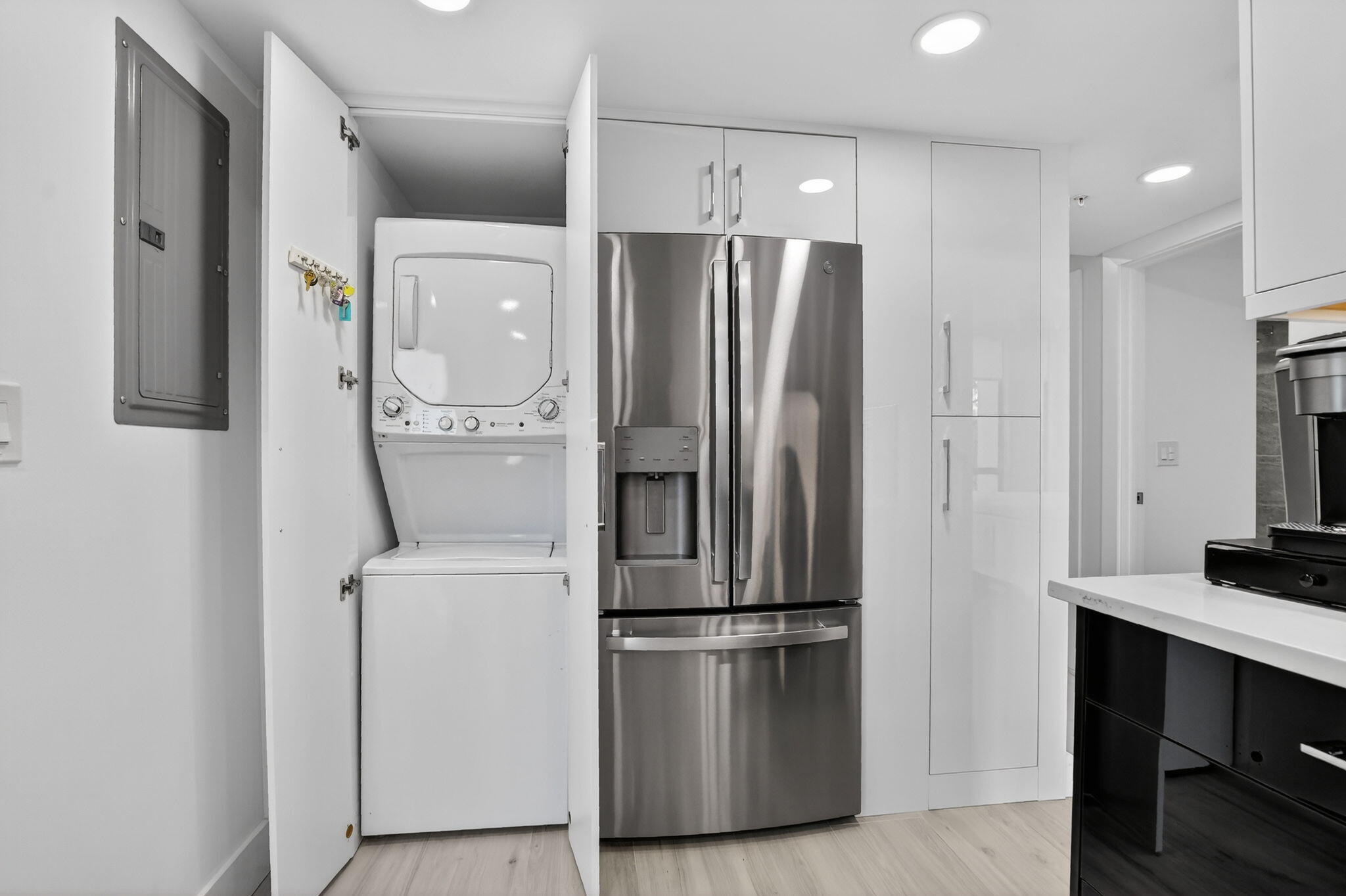 7802 Lakeside Boulevard, Unit 734 Boca Raton, FL 33434 - Photo 12 of 34 a kitchen with stainless steel appliances a refrigerator and microwave