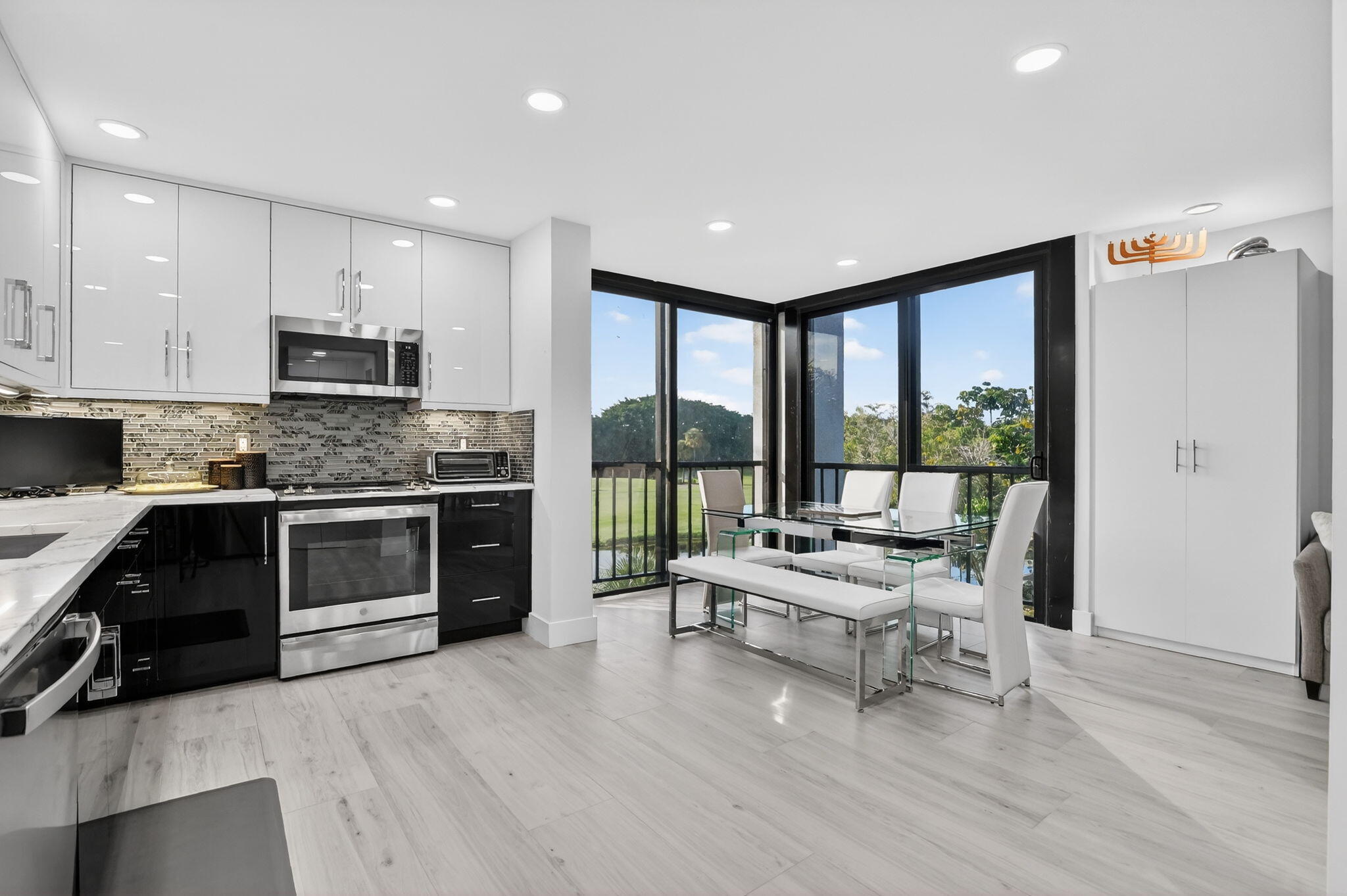7802 Lakeside Boulevard, Unit 734 Boca Raton, FL 33434 - Photo 13 of 34 a living room with furniture and a large window